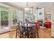 This is a spacious living room with abundant natural light and an adjoining dining area at 2130 Hollowbrooke Nw Way, Acworth, GA 30101