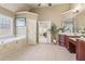 Beautiful main bathroom featuring a garden tub, double vanity, and tile flooring at 2130 Hollowbrooke Nw Way, Acworth, GA 30101