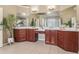 Elegant main bathroom with double sink vanity, mirrors, and tile floor at 2130 Hollowbrooke Nw Way, Acworth, GA 30101