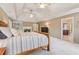 Comfortable main bedroom with a fireplace, decorative shelving, and a tray ceiling at 2130 Hollowbrooke Nw Way, Acworth, GA 30101
