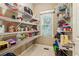 Walk-in pantry with wire shelving, a window, and organized food storage at 2130 Hollowbrooke Nw Way, Acworth, GA 30101
