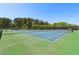 Community tennis courts showing fencing, nets and trees in the background at 2130 Hollowbrooke Nw Way, Acworth, GA 30101