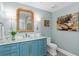 Charming bathroom with a blue vanity, marble countertop, and vintage-style fixtures at 3300 Windy Ridge Se Pkwy # 1501, Atlanta, GA 30339