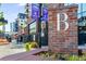 Exterior daytime view of building with large letter B on brick wall and sidewalk and street at 3300 Windy Ridge Se Pkwy # 1501, Atlanta, GA 30339