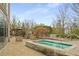 Beautiful hot tub with a stone base, with outdoor seating areas and a glimpse of the pool under a bright sky at 3300 Windy Ridge Se Pkwy # 1501, Atlanta, GA 30339