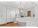 Well-lit kitchen with white cabinetry, marble countertops, and modern stainless appliances at 3300 Windy Ridge Se Pkwy # 1501, Atlanta, GA 30339