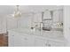 Kitchen island with white cabinets, marble countertop, and modern appliances at 3300 Windy Ridge Se Pkwy # 1501, Atlanta, GA 30339