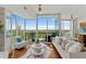 Spacious living room with floor-to-ceiling windows, modern decor, and beautiful natural light at 3300 Windy Ridge Se Pkwy # 1501, Atlanta, GA 30339