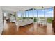 Bright living room with hardwood floors, expansive windows, and beautiful outdoor views at 3300 Windy Ridge Se Pkwy # 1501, Atlanta, GA 30339