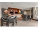 Inviting lounge area with wet bar, pendant lights, TV and comfortable seating at 3300 Windy Ridge Se Pkwy # 1501, Atlanta, GA 30339