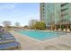 Luxury apartment with a stunning outdoor pool, and comfortable lounge chairs at 3300 Windy Ridge Se Pkwy # 1501, Atlanta, GA 30339