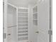 Bright and organized walk-in closet with built-in shelving and ample storage space at 3300 Windy Ridge Se Pkwy # 1501, Atlanta, GA 30339