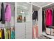 Spacious walk-in closet with custom shelving, hanging rods, and drawers for organized storage at 3300 Windy Ridge Se Pkwy # 1501, Atlanta, GA 30339