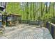 This back deck offers an ideal place for outdoor relaxation and dining surrounded by nature at 4812 Lismoor Sw Trce, Mableton, GA 30126