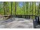 Enjoy outdoor living on this back deck, surrounded by mature trees and landscaping at 4812 Lismoor Sw Trce, Mableton, GA 30126