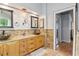 The main bathroom features a double sink, granite countertop, and decorative light fixtures at 4812 Lismoor Sw Trce, Mableton, GA 30126