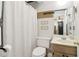 This bathroom offers a clean aesthetic with a shower featuring a white curtain and updated hardware at 4812 Lismoor Sw Trce, Mableton, GA 30126