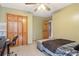 This bedroom is carpeted and has a built-in closet and adjacent doorway at 4812 Lismoor Sw Trce, Mableton, GA 30126