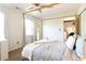This well-lit primary bedroom has a bed with a metal frame and a large storage closet at 4812 Lismoor Sw Trce, Mableton, GA 30126