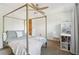 This primary bedroom has a bed with a metal frame, a ceiling fan and a carpeted floor at 4812 Lismoor Sw Trce, Mableton, GA 30126