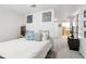 This cozy bedroom has white walls, carpet and is decorated with artwork at 4812 Lismoor Sw Trce, Mableton, GA 30126