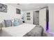 This cozy bedroom has white walls, carpet and is decorated with artwork at 4812 Lismoor Sw Trce, Mableton, GA 30126