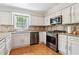 Modern kitchen featuring stainless steel appliances and white cabinets and countertops at 4812 Lismoor Sw Trce, Mableton, GA 30126