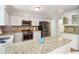 Gorgeous kitchen featuring stainless appliances, granite counters, and hexagon tile backsplash at 4812 Lismoor Sw Trce, Mableton, GA 30126
