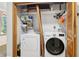 This laundry room has a washer and dryer and built in shelving at 4812 Lismoor Sw Trce, Mableton, GA 30126