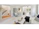 Bright living room with white floors leading to a room with two massage beds at 4812 Lismoor Sw Trce, Mableton, GA 30126