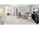 Open living space with white floors, stylish decor, and lots of natural light at 4812 Lismoor Sw Trce, Mableton, GA 30126