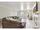 Spacious living room featuring a fireplace, plush sofa, and bright, neutral decor at 4812 Lismoor Sw Trce, Mableton, GA 30126