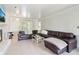 Bright and airy living space featuring a modern fireplace and plush leather sofa at 4812 Lismoor Sw Trce, Mableton, GA 30126