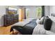 The main bedroom features hardwood floors, ample storage, and a picturesque view at 4812 Lismoor Sw Trce, Mableton, GA 30126