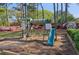 Community playground featuring a slide, swings, and playhouse at 4812 Lismoor Sw Trce, Mableton, GA 30126