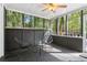 A cozy screened porch provides a perfect outdoor retreat with comfortable seating, surrounded by nature at 4812 Lismoor Sw Trce, Mableton, GA 30126