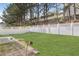 Spacious backyard with a white fence at 8849 Seneca Rd, Palmetto, GA 30268