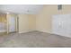Neutral bedroom featuring vaulted ceilings and multiple closets at 8849 Seneca Rd, Palmetto, GA 30268