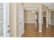 Welcoming entryway with hardwood floors leading to a spacious dining area and cozy fireplace at 8849 Seneca Rd, Palmetto, GA 30268