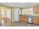 Bright kitchen features stainless steel appliances and views into the dining area at 8849 Seneca Rd, Palmetto, GA 30268