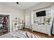 Bedroom featuring hardwood floors, natural light, and a desk with vanity at 940 Austin Ave, Atlanta, GA 30307