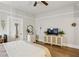 Neutral bedroom featuring hardwood floors, a ceiling fan, and furniture at 940 Austin Ave, Atlanta, GA 30307