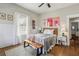 Bedroom featuring hardwood floors, natural light, and stylish decor at 940 Austin Ave, Atlanta, GA 30307