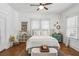 Bright bedroom features hardwood floors, windows, and an area rug at 940 Austin Ave, Atlanta, GA 30307