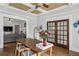 Dining area with wood floors, farmhouse table, and doorway to living room, perfect for Gathering meals at 940 Austin Ave, Atlanta, GA 30307