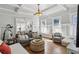 Bright living area with hardwood floors, large windows, and comfortable seating for relaxation and entertaining at 940 Austin Ave, Atlanta, GA 30307