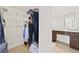 This bathroom features granite countertop, custom wood cabinets, and walk-in closet with custom shelving at 1468 Briarwood Ne Rd # 810, Brookhaven, GA 30319