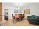 This dining room features hardwood floors, a dark wood table, seating for six, and decor throughout at 1468 Briarwood Ne Rd # 810, Brookhaven, GA 30319