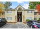 Charming two-story condo with inviting entrance, stone accents, and ample parking spaces at 1468 Briarwood Ne Rd # 810, Brookhaven, GA 30319