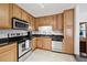 Modern kitchen with stainless steel appliances, granite countertops and tiled backsplash at 1468 Briarwood Ne Rd # 810, Brookhaven, GA 30319